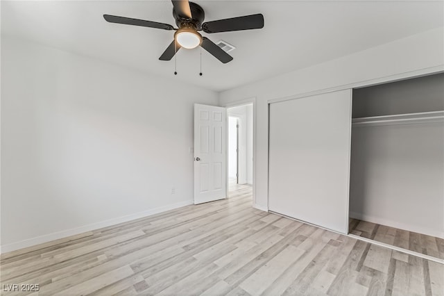 2915 Cedar Ave Unit 12C, Las Vegas, NV 89101 - unfurnished bedroom featuring visible vents, a ceiling fan, a closet, light wood-style floors, and baseboards