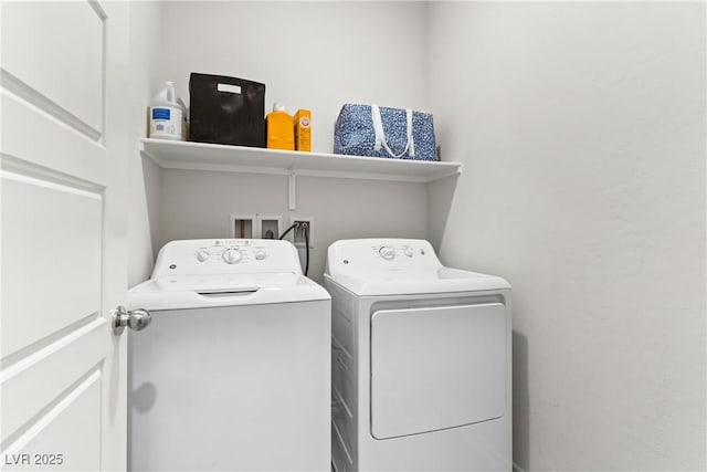 washroom featuring washing machine and clothes dryer