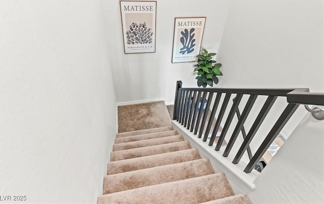 stairs featuring baseboards
