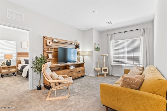 living room featuring carpet and baseboards