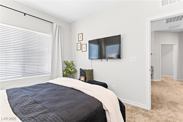 carpeted bedroom with baseboards