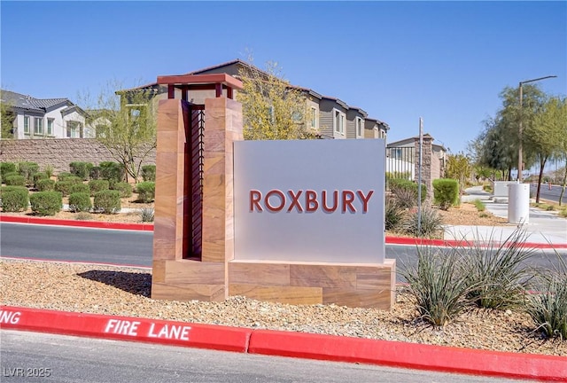 community / neighborhood sign featuring a residential view