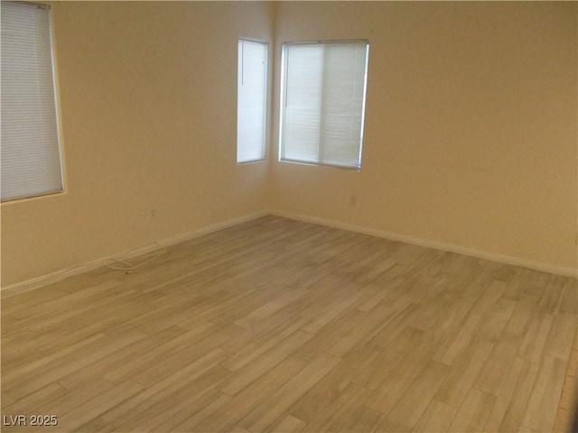 5481 Railroad River Ave, Las Vegas, NV 89139 - spare room featuring light wood-style flooring and baseboards