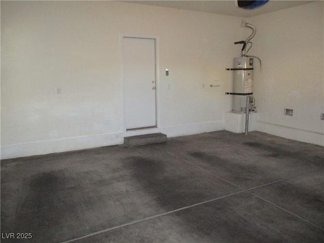 5481 Railroad River Ave, Las Vegas, NV 89139 - garage featuring strapped water heater and baseboards