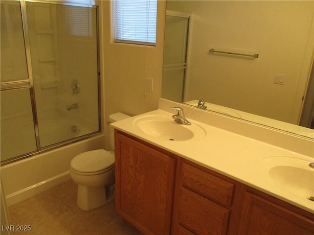 5481 Railroad River Ave, Las Vegas, NV 89139 - full bath featuring double vanity, toilet, combined bath / shower with glass door, and tile patterned flooring