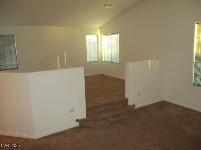 5481 Railroad River Ave, Las Vegas, NV 89139 - carpeted empty room featuring vaulted ceiling and baseboards