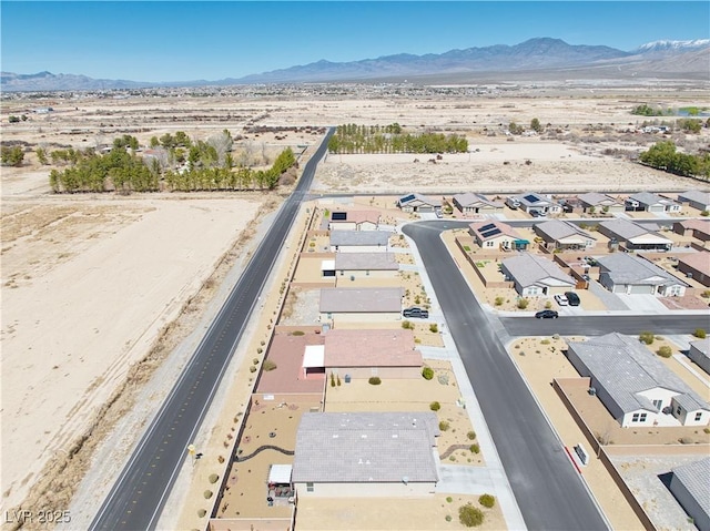 aerial view featuring a mountain view and a residential view