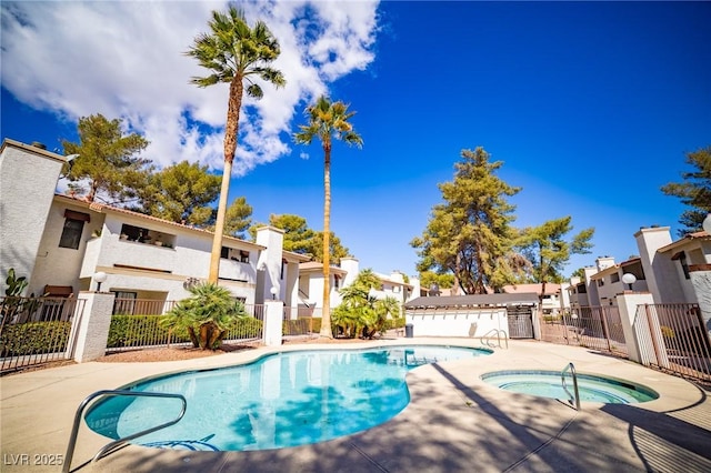 6649 W Tropicana Ave Unit 101, Las Vegas, NV 89103 - community pool with a community hot tub, a patio area, and a residential view