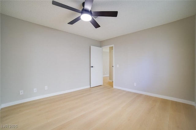 6649 W Tropicana Ave Unit 101, Las Vegas, NV 89103 - unfurnished room featuring wood finished floors, a ceiling fan, and baseboards