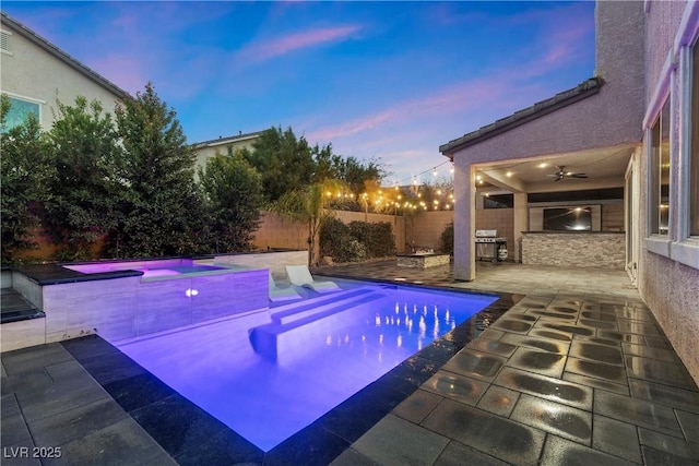 view of swimming pool featuring a fenced backyard, a fenced in pool, a jacuzzi, and a patio area