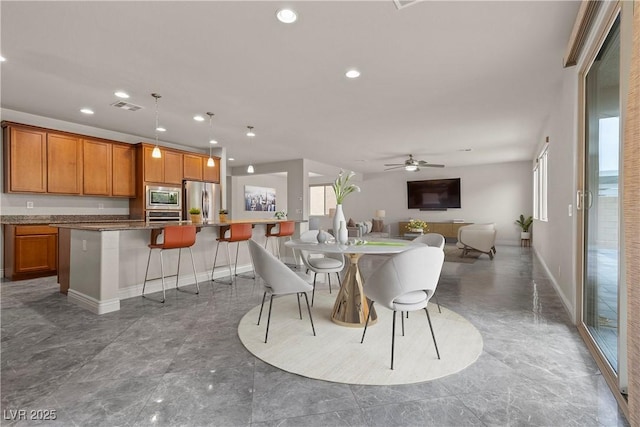 dining space with visible vents, a ceiling fan, baseboards, and recessed lighting