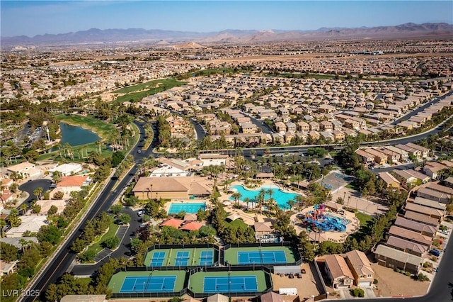 bird's eye view with a water and mountain view and a residential view
