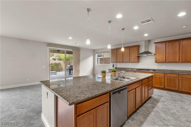 kitchen with a sink, wall chimney exhaust hood, stainless steel appliances, recessed lighting, and visible vents