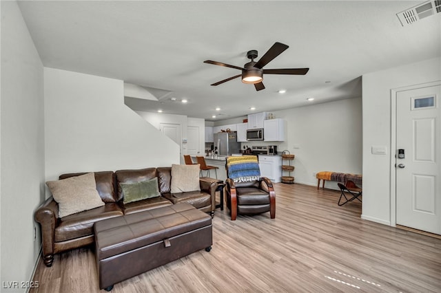 3725 Celesta Vista Ave, Henderson, NV 89044 - living room featuring a ceiling fan, light wood-style floors, baseboards, and recessed lighting