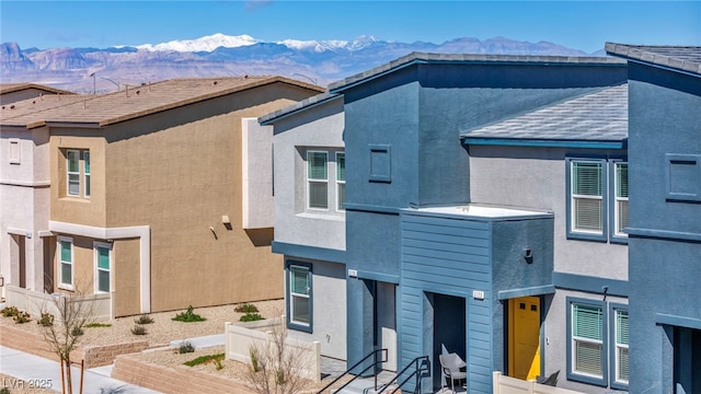3725 Celesta Vista Ave, Henderson, NV 89044 - view of home's exterior with a mountain view, stucco siding, and fence