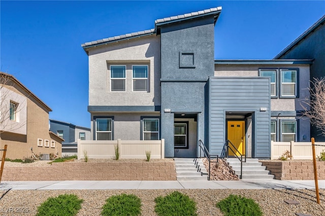 3725 Celesta Vista Ave, Henderson, NV 89044 - view of front of home with stucco siding, central AC, and fence