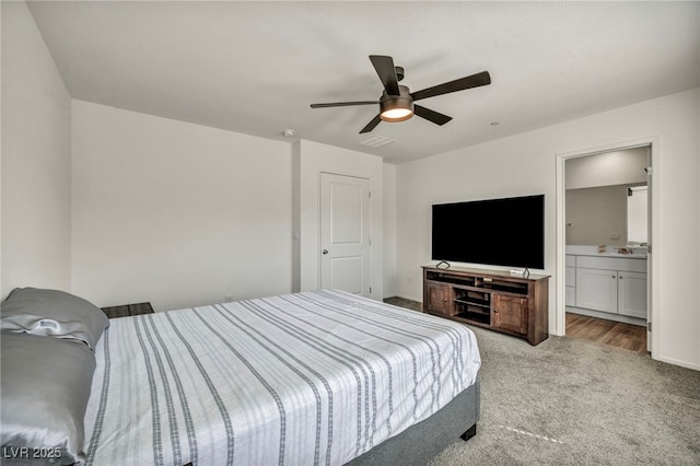 3725 Celesta Vista Ave, Henderson, NV 89044 - bedroom featuring carpet flooring, ceiling fan, baseboards, ensuite bathroom, and a sink
