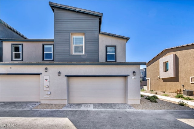 3725 Celesta Vista Ave, Henderson, NV 89044 - view of front of home featuring central AC, an attached garage, and stucco siding
