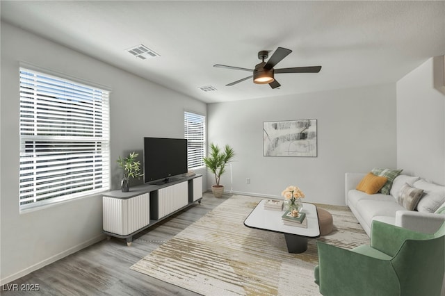 3725 Celesta Vista Ave, Henderson, NV 89044 - living room with ceiling fan, healthy amount of natural light, wood finished floors, and baseboards