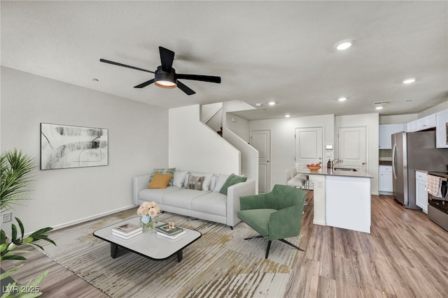 3725 Celesta Vista Ave, Henderson, NV 89044 - living area featuring light wood finished floors, a ceiling fan, baseboards, and recessed lighting