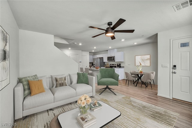 3725 Celesta Vista Ave, Henderson, NV 89044 - living area featuring light wood-style floors, a ceiling fan, and recessed lighting