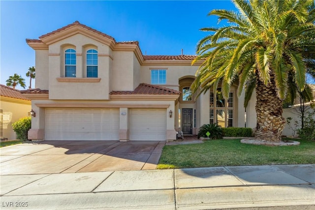 9517 Spanish Steps Ln, Las Vegas, NV 89117 - mediterranean / spanish home featuring stucco siding, a tile roof, an attached garage, and driveway