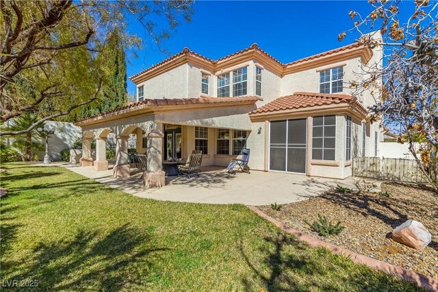 9517 Spanish Steps Ln, Las Vegas, NV 89117 - back of property featuring a tiled roof, stucco siding, and a patio