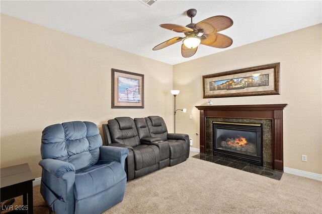 9517 Spanish Steps Ln, Las Vegas, NV 89117 - carpeted living room featuring baseboards, ceiling fan, and a premium fireplace
