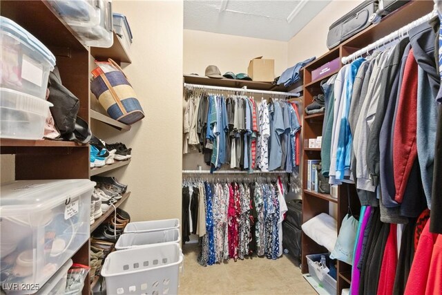 9517 Spanish Steps Ln, Las Vegas, NV 89117 - walk in closet featuring attic access