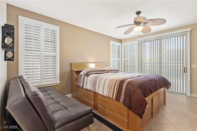 9517 Spanish Steps Ln, Las Vegas, NV 89117 - bedroom with access to outside, baseboards, multiple windows, and light tile patterned flooring