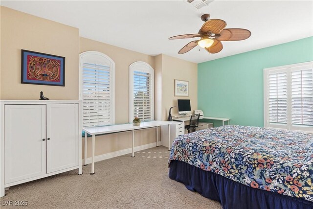 9517 Spanish Steps Ln, Las Vegas, NV 89117 - bedroom featuring light carpet, an office area, and a ceiling fan