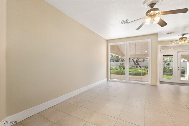 9517 Spanish Steps Ln, Las Vegas, NV 89117 - unfurnished room featuring ceiling fan, light tile patterned floors, baseboards, and plenty of natural light