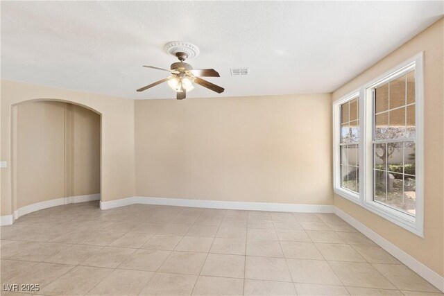 9517 Spanish Steps Ln, Las Vegas, NV 89117 - unfurnished room featuring light tile patterned floors, a ceiling fan, and baseboards