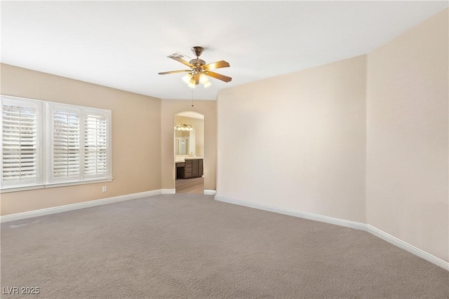 9517 Spanish Steps Ln, Las Vegas, NV 89117 - unfurnished room featuring a ceiling fan, light colored carpet, and baseboards