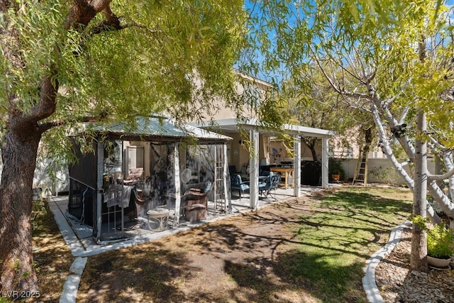 8125 Boxberry Ave, Las Vegas, NV 89131 - rear view of property with fence and a patio area
