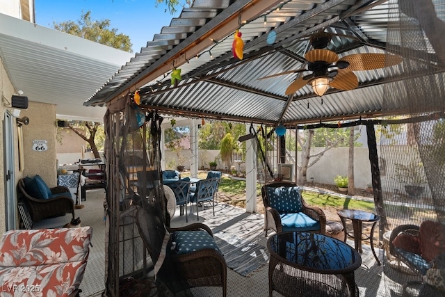 8125 Boxberry Ave, Las Vegas, NV 89131 - view of patio / terrace with outdoor dining area, ceiling fan, and a fenced backyard