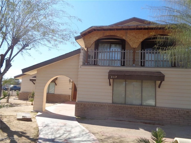 3127 Aloha Ave, Las Vegas, NV 89121 - view of front of house featuring brick siding and a balcony