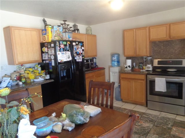 3127 Aloha Ave, Las Vegas, NV 89121 - kitchen with electric range, tasteful backsplash, dark countertops, and black fridge