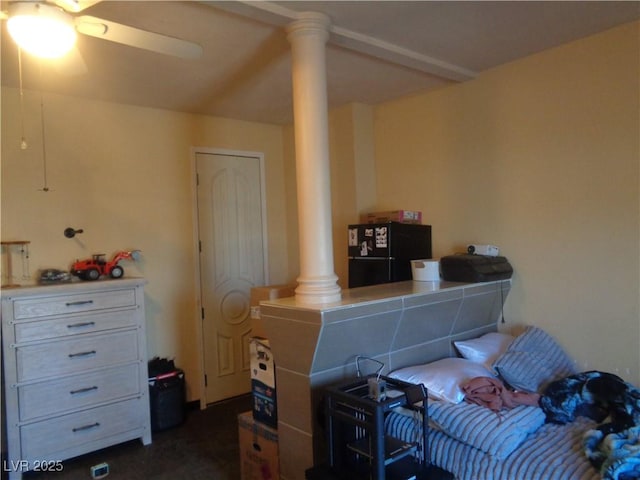 3127 Aloha Ave, Las Vegas, NV 89121 - bedroom featuring ornate columns, ceiling fan, and freestanding refrigerator