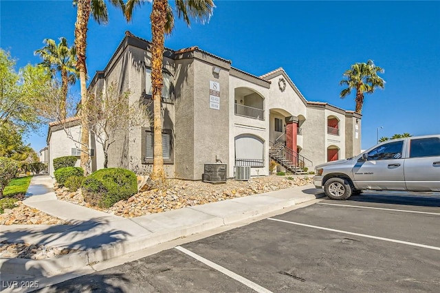 950 Seven Hills Dr Unit 814, Henderson, NV 89052 - view of front facade with stucco siding and uncovered parking