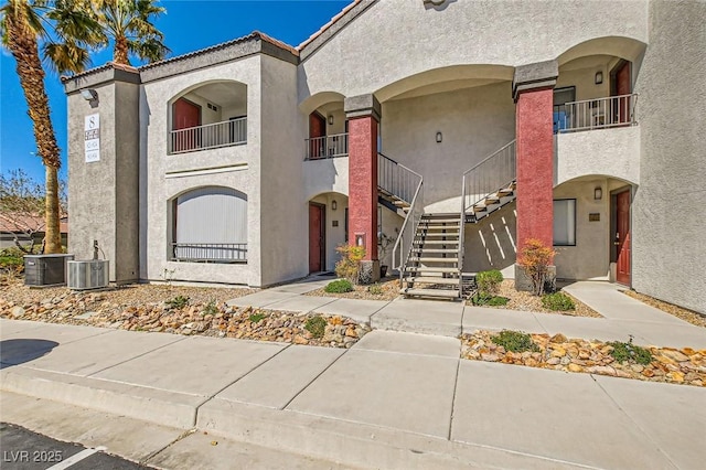 950 Seven Hills Dr Unit 814, Henderson, NV 89052 - view of front of house featuring stucco siding, stairs, and central air condition unit