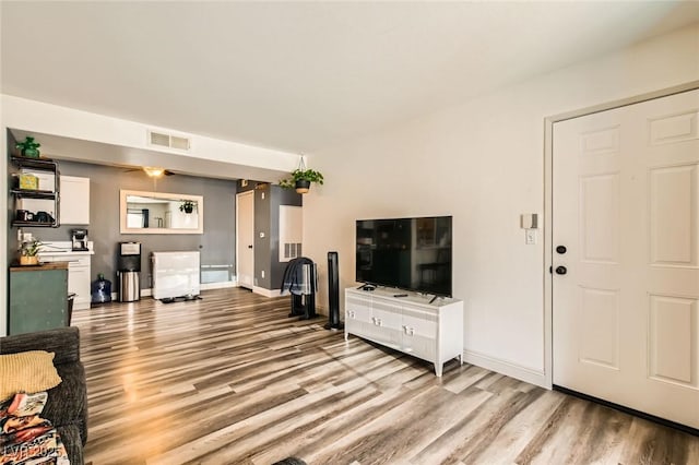 950 Seven Hills Dr Unit 814, Henderson, NV 89052 - living room featuring baseboards, light wood finished floors, and visible vents
