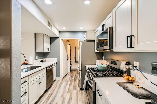950 Seven Hills Dr Unit 814, Henderson, NV 89052 - kitchen featuring light countertops, stainless steel appliances, recessed lighting, a sink, and light wood-type flooring