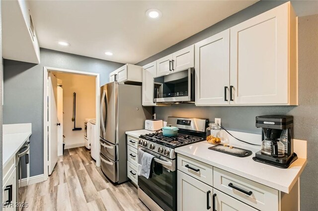 950 Seven Hills Dr Unit 814, Henderson, NV 89052 - kitchen with light countertops, light wood-style flooring, white cabinets, stainless steel appliances, and recessed lighting