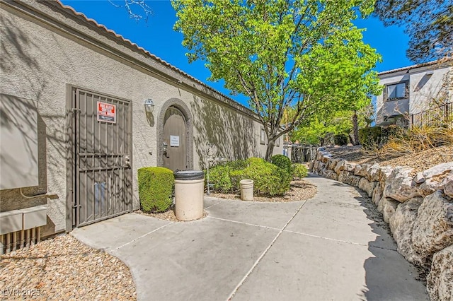 950 Seven Hills Dr Unit 814, Henderson, NV 89052 - property entrance featuring a tile roof and stucco siding