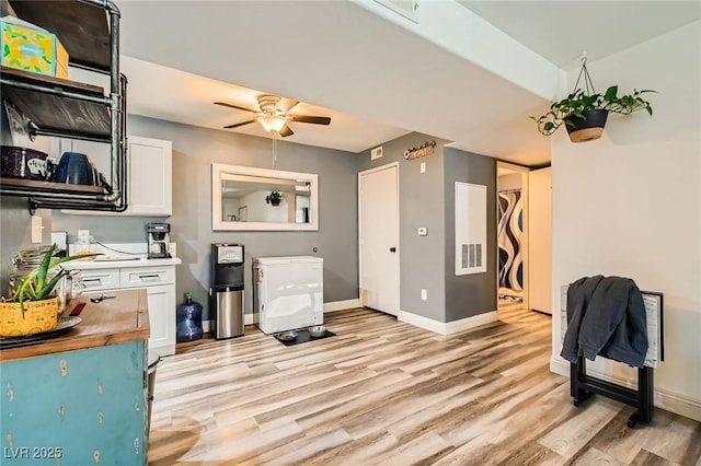950 Seven Hills Dr Unit 814, Henderson, NV 89052 - interior space featuring white cabinets, light wood-style flooring, baseboards, butcher block counters, and a ceiling fan