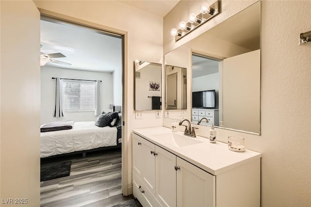 950 Seven Hills Dr Unit 814, Henderson, NV 89052 - bathroom with ensuite bathroom, wood finished floors, ceiling fan, and vanity
