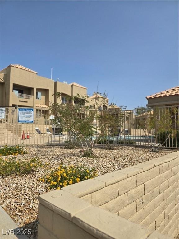 exterior space with a residential view and fence