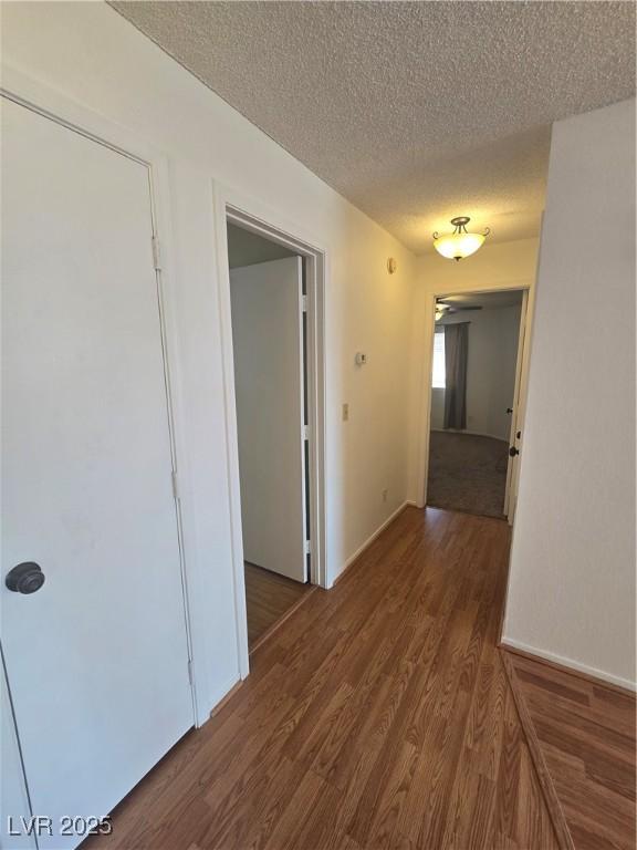 2232 Aspen Mirror Way Unit 204, Laughlin, NV 89029 - hall featuring wood finished floors and a textured ceiling