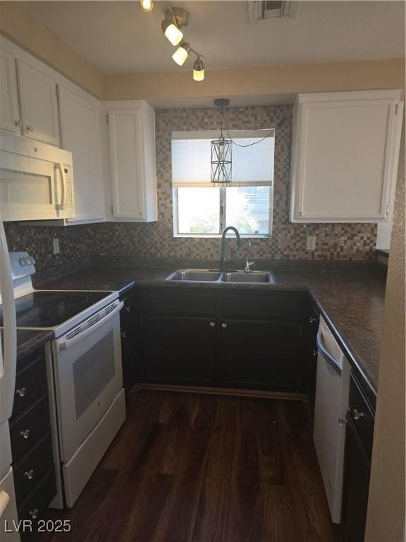 2232 Aspen Mirror Way Unit 204, Laughlin, NV 89029 - kitchen with white appliances, a sink, dark countertops, dark wood-style floors, and white cabinets